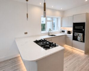 After photo of the semi-island kitchen installation in Pontarddulais project