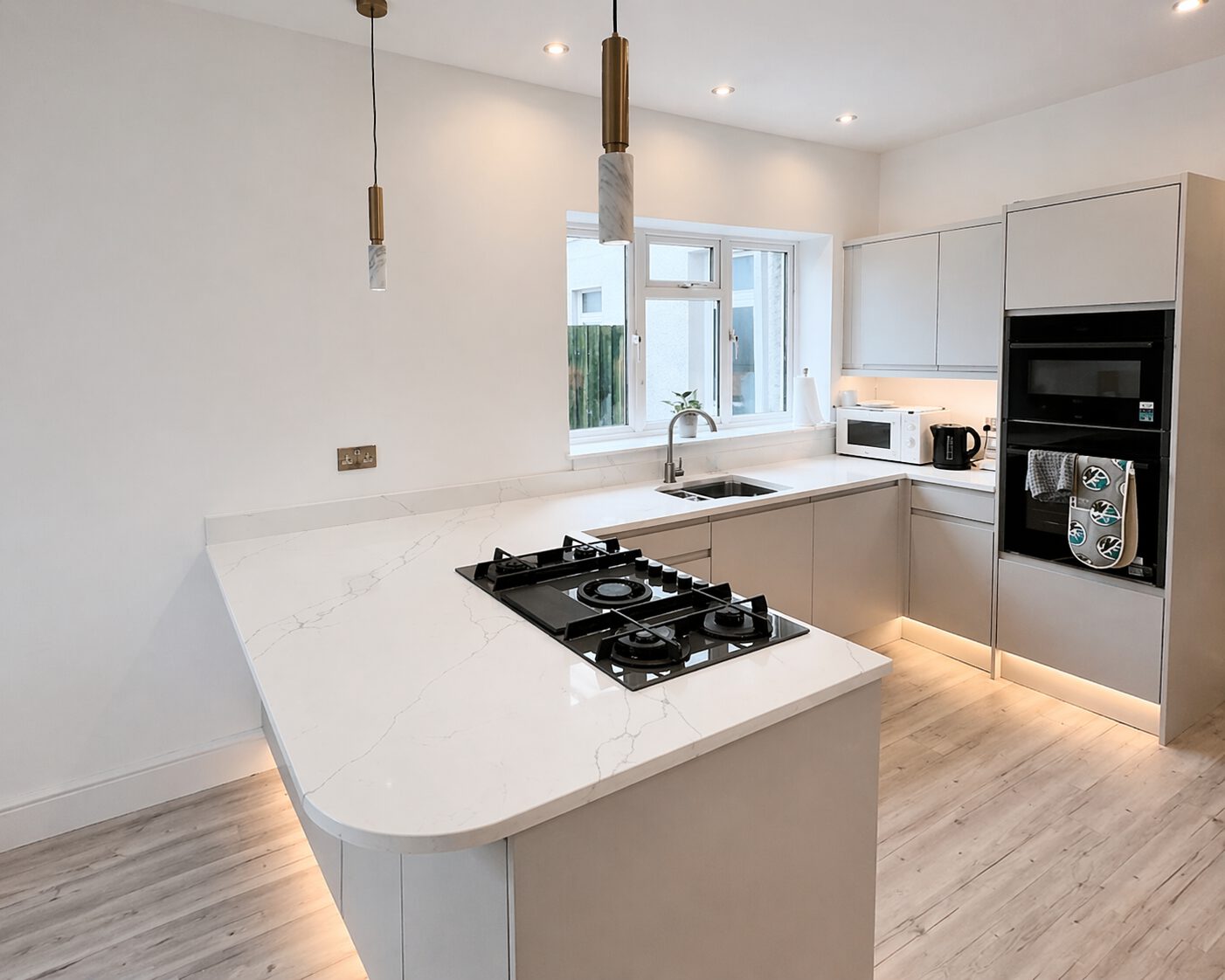 After photo of the semi-island kitchen installation in Pontarddulais project