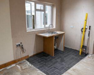 Before photo of the semi-island kitchen installation in Pontarddulais project