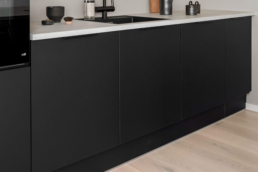 Kitchen doors that have been replaced with black cabinets