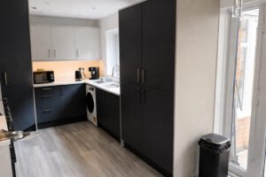 Modern grey kitchen with pantry unit