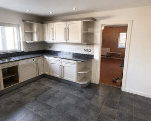 Before photo of the gloss kitchen & island installation in Mayals project