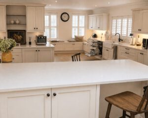 After photo of the large painted kitchen with island in Penllergaer project
